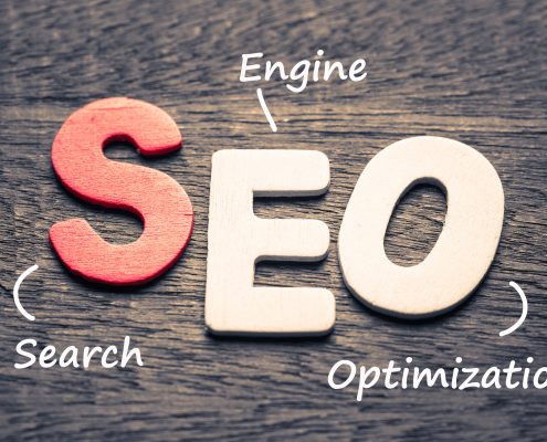 Wood letters of SEO and definition on wood background