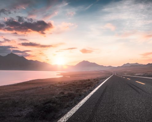 Lake and road at sunset